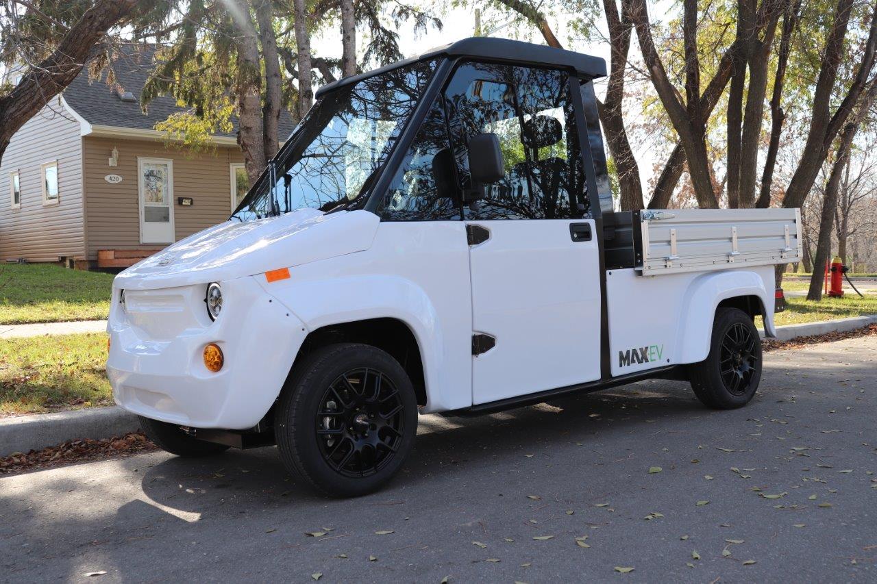 Electric Utility Vehicle on street with electric motor.