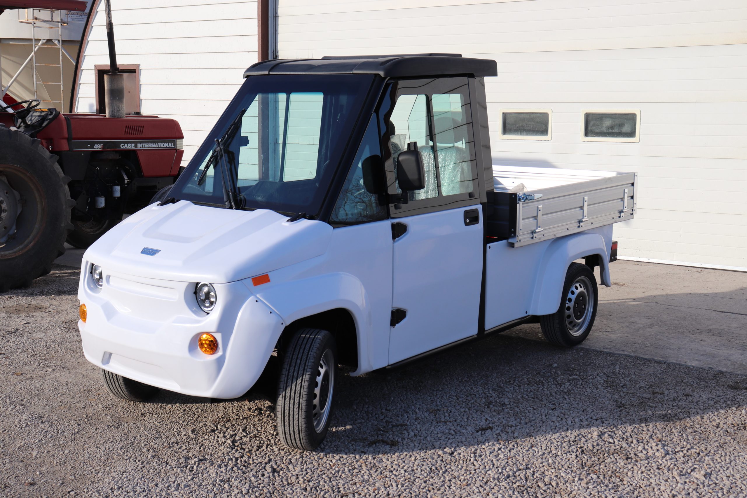 Electric Utility Vehicle driving on gravel