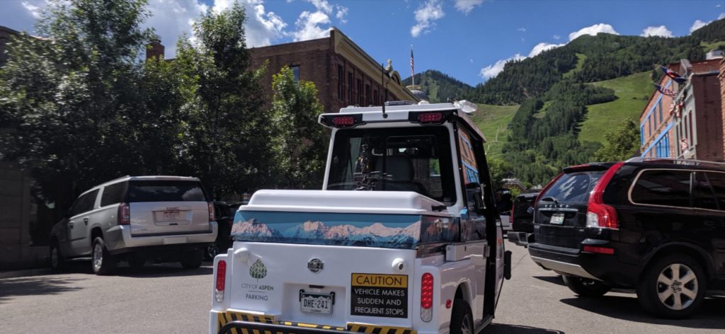 GO-4 low speed vehicle working the streets in Aspen, Colorado