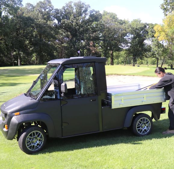 electric utility trucks on golf course